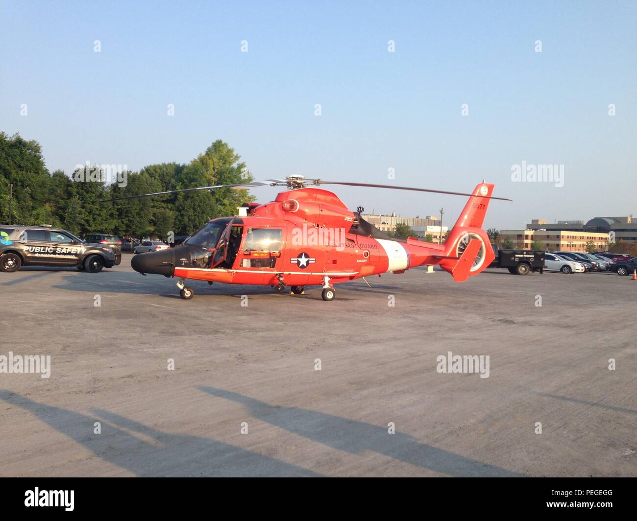 A Coast Guard MH-65 Dolphin helicopter on sits on deck at Lehigh Valley Hospital in Allentown Pa., Tuesday, Aug. 18, 2015. The aircrew medevaced a man from the Delaware Water Gap who suffered multiple injuries after falling from a tree. (U.S. Coast Guard photo by LT Christopher Hooper) Stock Photo