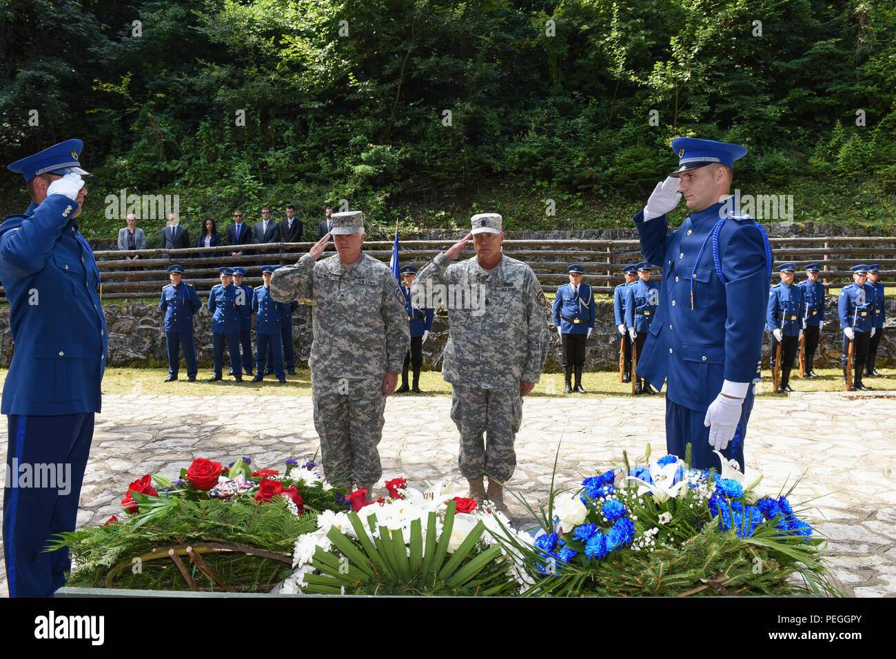 U.S. Army Brig. Gen. Giselle Wilz, NATO Headquarters Sarajevo commander, and Command Sgt. Maj. Harley Schwind, NHQSa command senior enlisted leader, paid respects during a memorial ceremony at Mount Igman in Bosnia and Herzegovina Aug. 19, 2015. On Aug. 19, 1995, three American diplomats and a French soldier died during an automobile accident while traveling on Igman while on a mission to negotiate a U.S. proposal for peace in Bosnia. The diplomats were Ambassadors Robert C. Frasure and Joseph Kruzel, and U.S. Air Force Col. Sam Nelson Drew; the French soldier was Stephan Reault. (U.S. Air For Stock Photo