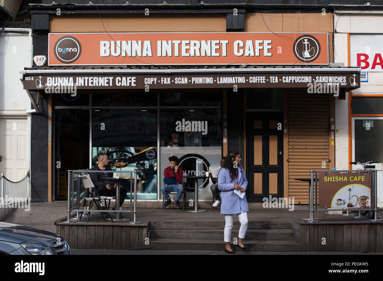 Customers outside the Bunna Internet Cafe in Stratford Road in Sparkbrook, Birmingham. There was a police presence near the cafe on Tuesday but it was not confirmed whether that was in relation to the probe into the suspected terror attack on Westminster. Stock Photo