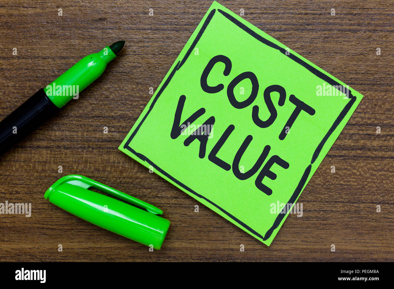 Conceptual hand writing showing Cost Value. Business photo showcasing The amount that usualy paid for a item you buy or hiring a person Green Paper Co Stock Photo