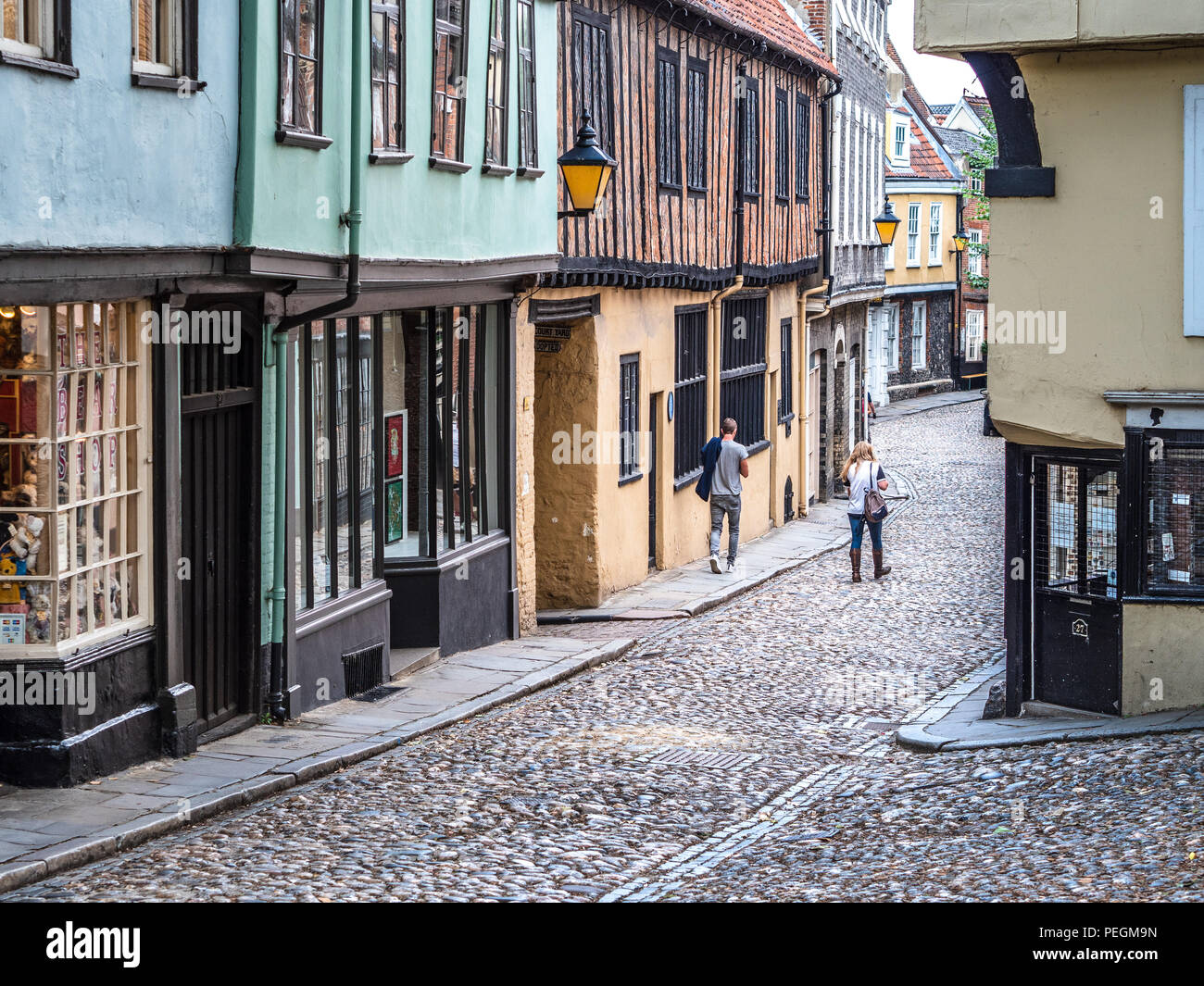 Elm Hill Norwich - a historic cobbled lane in central Norwich, UK. The street contains a number of historic buildings dating back to Tudor times. Stock Photo