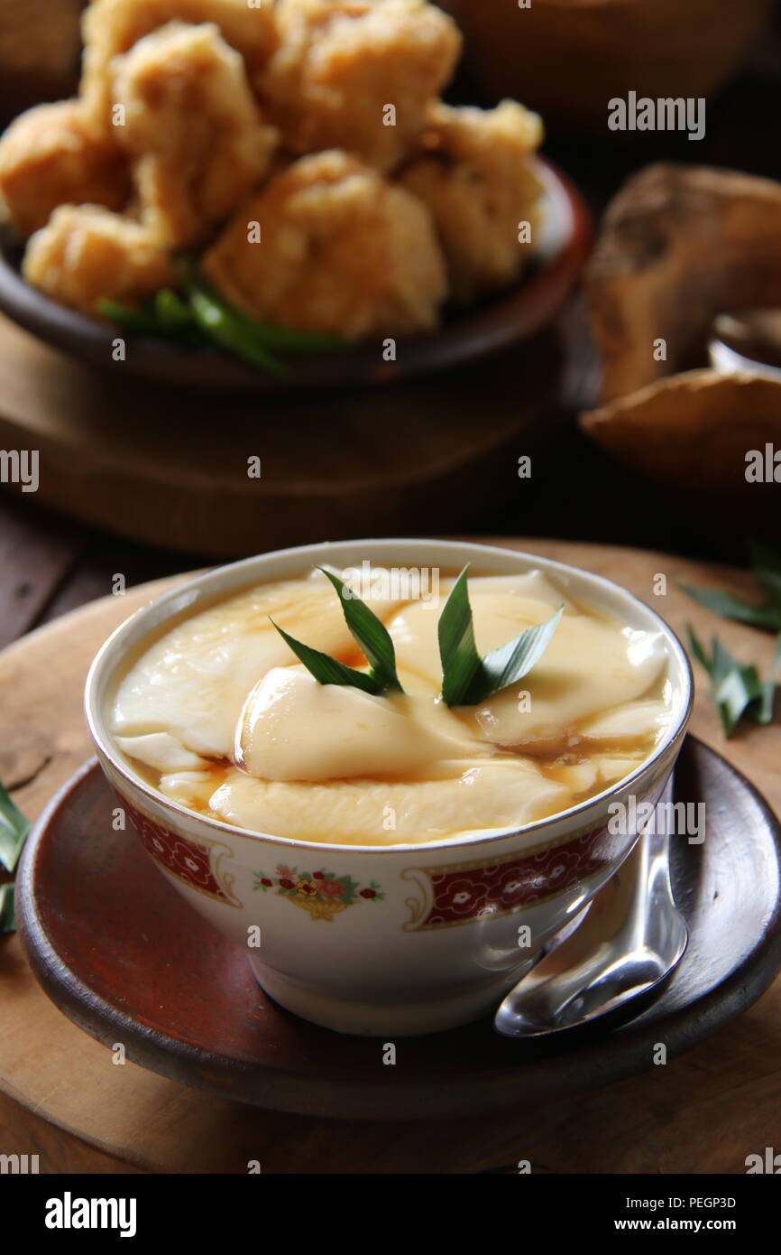 Wedang Tahu. PeranakanJavanese warm dessert of tofu pudding in ginger