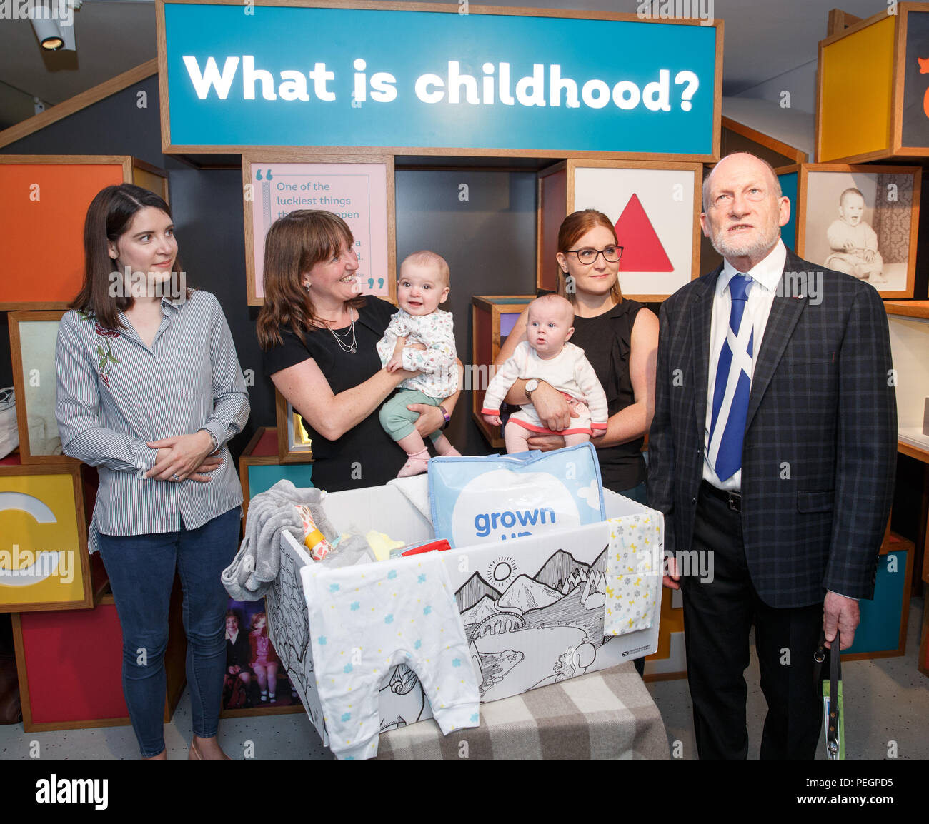 Maree Todd (second left), Minister for Children and Young People, with (left to right) Sarah Morrison and daughter Chrissie, Gillian Steele with daughter Erin and Councillor Derek Howie, marks the first anniversary of the Baby Box initiative at the Museum of Childhood, as one of the boxes is to be preserved in history as an exhibit at the Edinburgh attraction. Stock Photo