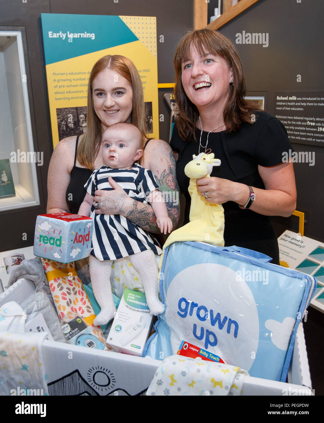 Maree Todd (right), Minister for Children and Young People, with Jennifer Scott and her daughter Hailie who received the box, marks the first anniversary of the Baby Box initiative at the Museum of Childhood as one of the boxes is to be preserved in history as an exhibit at the Edinburgh attraction. Stock Photo