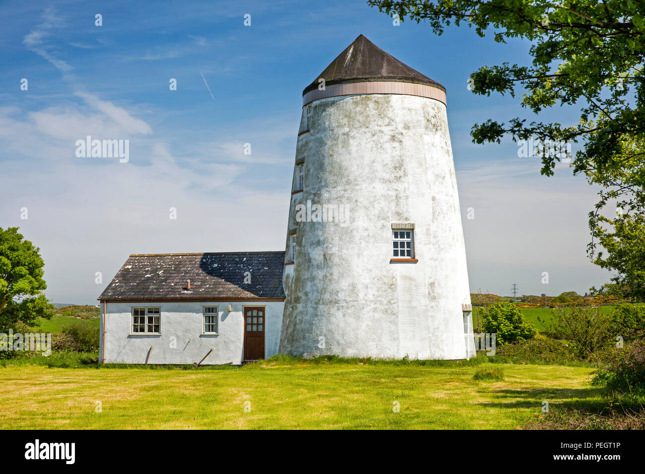 UK, Wales, Anglesey, Llanfechell, old redundant windmill converted into house Stock Photo