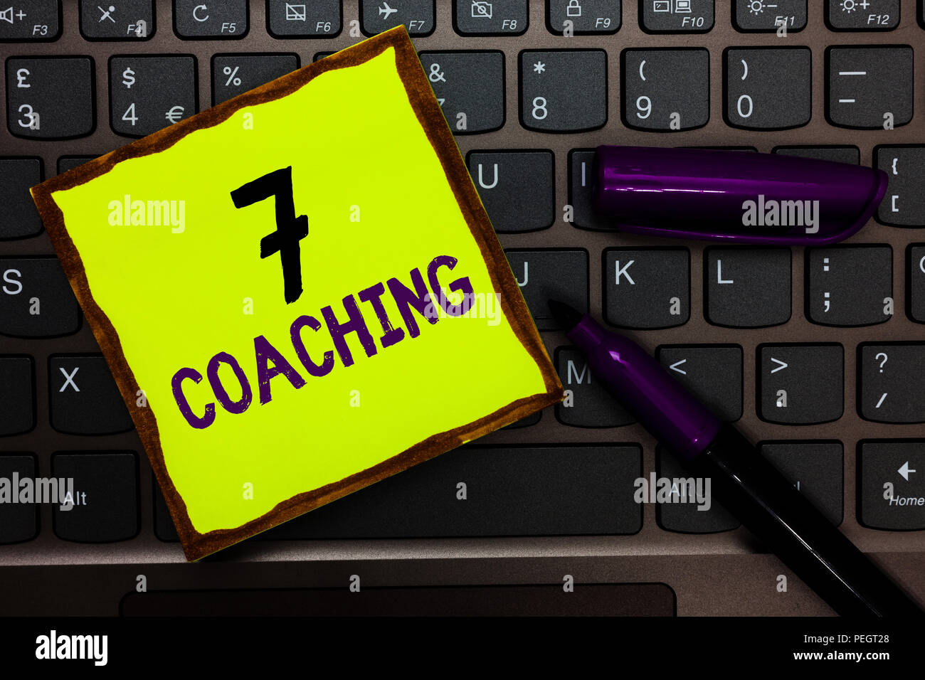 Handwriting text 7 Coaching. Concept meaning Refers to a number of figures regarding business to be succesful Yellow paper keyboard Inspiration commun Stock Photo