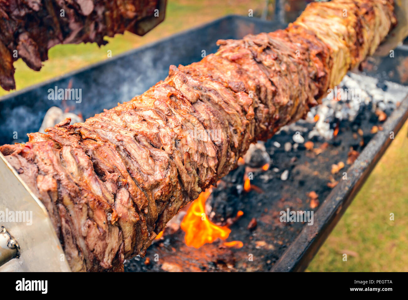 Spit roast charcoal BBQ meat Stock Photo Alamy