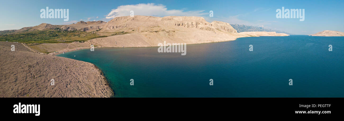 Aerial view of Rucica beach on Pag island, Metajna, Croatia. Seabed and beach seen from above, bathers. Promontories and cliffs of Croatian coasts Stock Photo