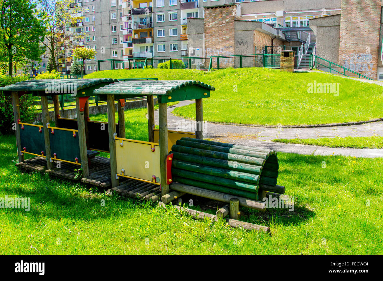 Children’s playground with a wooden train in the yard Stock Photo - Alamy
