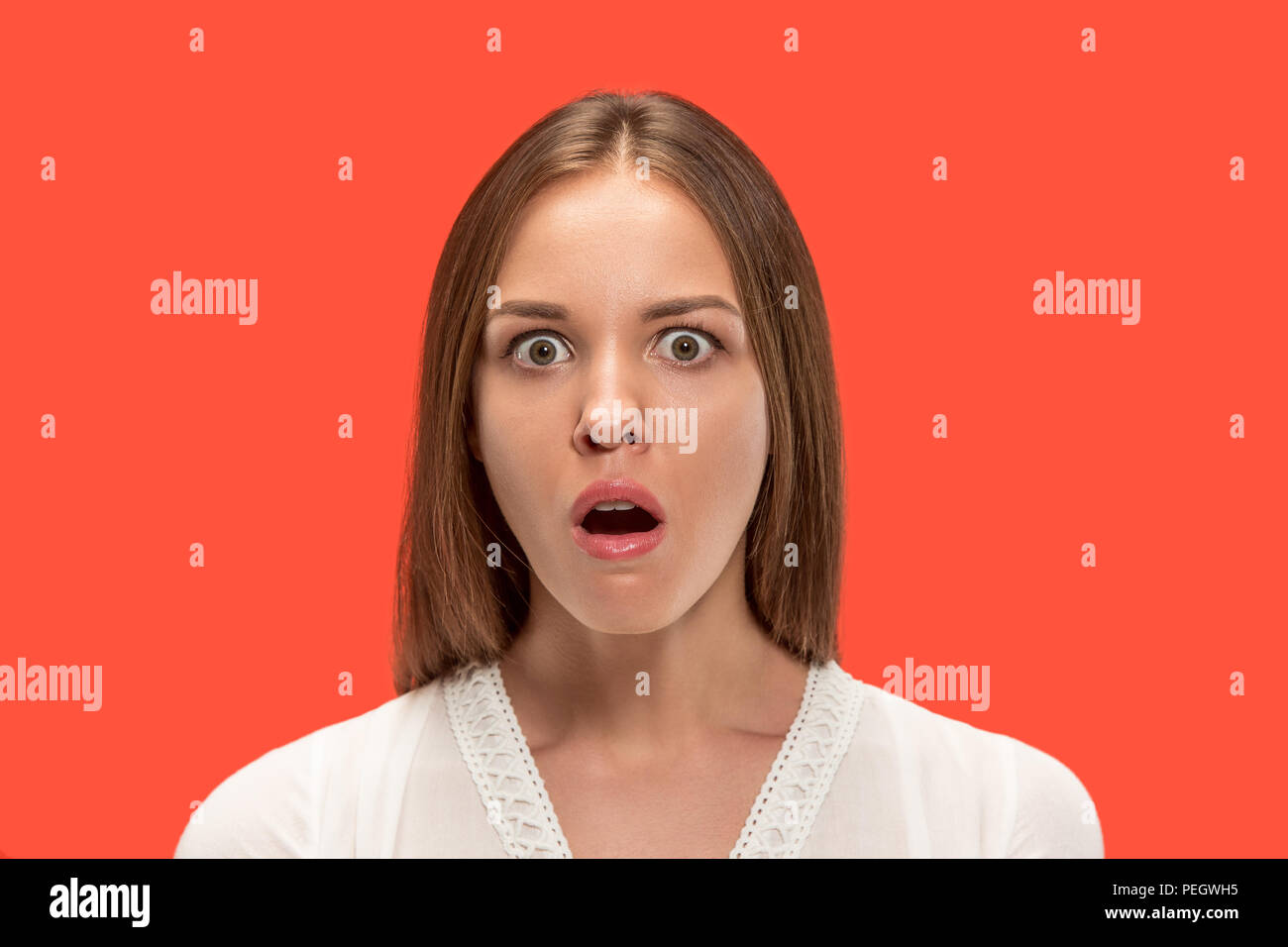 Premium Photo  Portrait of shocked and amazed attractive woman covering  breast with palm gasping and dropping jaw from surprise standing over gray  wall