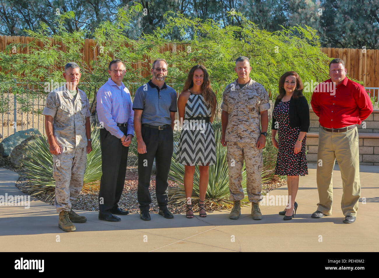 Maj. Gen. Lewis A. Craparotta, Combat Center Commanding General, and Col. James Hanlon, chief of staff, recognize civilians Scott Kinner, doctrine developer and writer, MCTOG, Richard Buckles, environmental compliance inspector, NREA, Gina Sanchez, human resources assistant, Human Resources Office, Jo Rosbough, financial management analyst and Andy Watson, deputy head, MAGTF Support Department, MCLOG, for outstanding work at the home of the Commanding General. (Official Marine Corps photo by Lance Cpl. Maliek Fowler/Released) Stock Photo