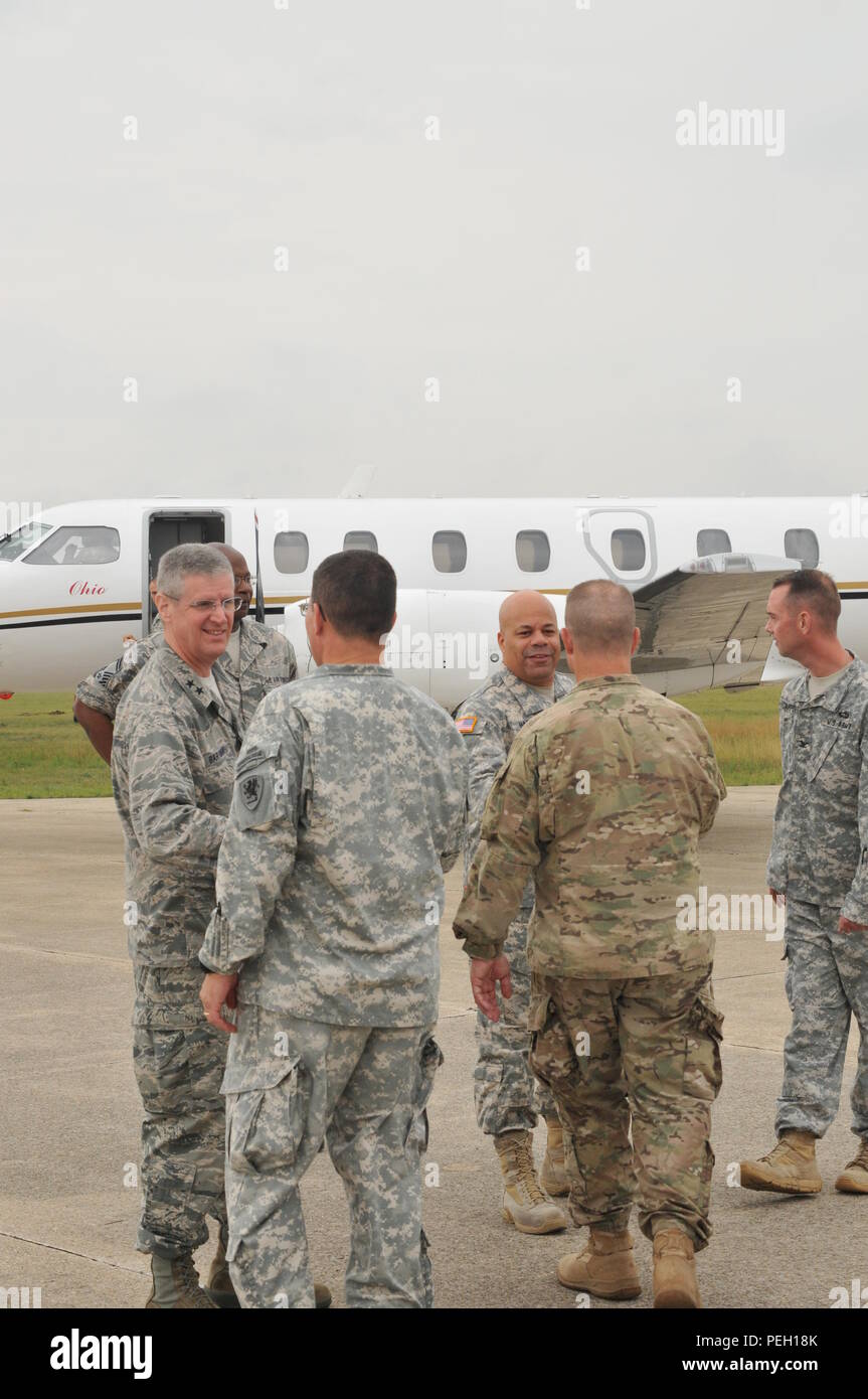 Maj. Gen. Mark E. Bartman (left), Ohio adjutant general, and Maj. Gen. John C. Harris Jr. (third from right) are greeted by 37th Infantry Brigade Combat Team leadership upon their arrival Aug. 18, 2015, at Camp Grayling, Mich. Ohio National Guard senior leaders were visiting 37th IBCT Soldiers conducting their two-week annual training. (U.S. Army photo by Staff Sgt. Kimberly Johnson/Released) Stock Photo