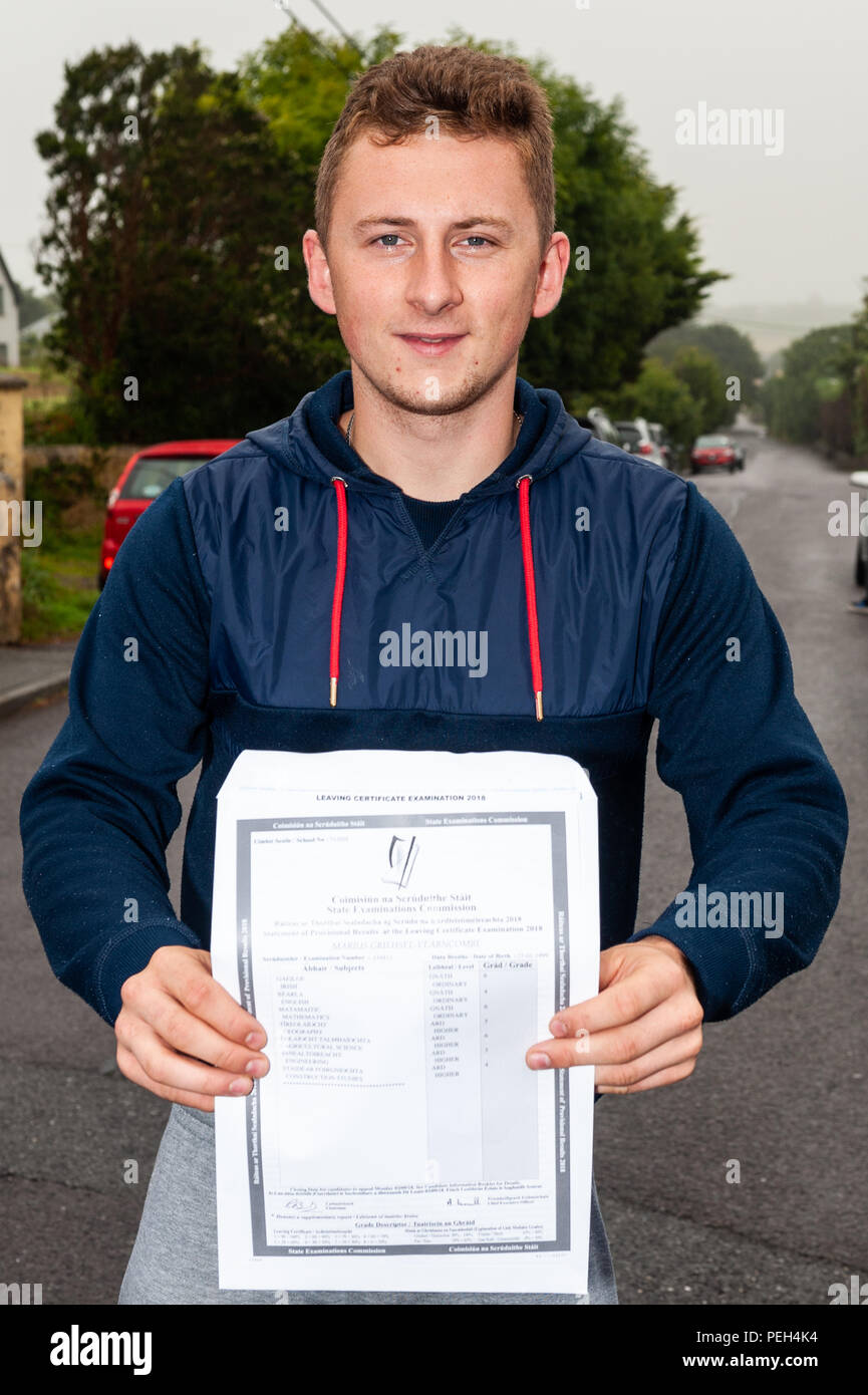 Schull, West Cork, Ireland. 15th Aug, 2018. Marius Vearncombe, son of the late Colin Vearncombe (AKA Black) holds out his Leaving Cert results. A total of 57,149 students will receive their results today. This is the second year of the new grading system which means there are only 8 grades now, instead of 14 in previous years. Credit: Andy Gibson/Alamy Live News. Stock Photo
