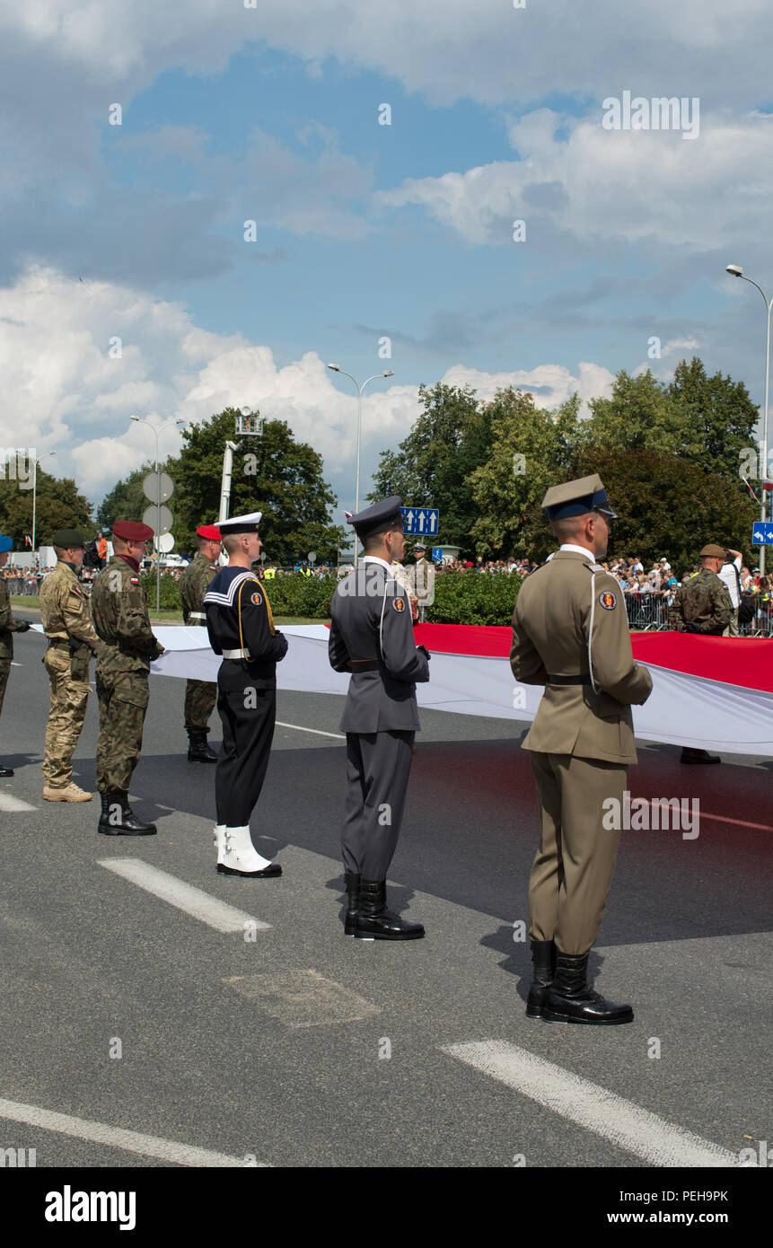 Warsaw, Poland, 15th Aug, 2018: Poland celebrates the annual Armed Forces Day and 98th anniversary of the Battle of Warsaw. Grand Independence Parade with more than 2,000 troops, hundreds re-enactors, different types of military vehicles, more or less 100 planes and helicopters and 100,000 audience took place in the Poland’s capital. Small units from the US, the UK, Croatia and Romania marched together with Polish soldiers. President Andrzej Duda of Poland, Mateusz Morawiecki (PM) and Mariusz Blaszczak (MoD) took part in the event. Credit: dario photography/Alamy Live News. Stock Photo