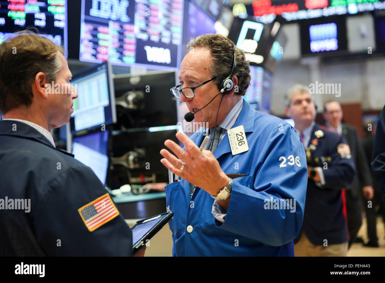 New York, USA. 15th Aug, 2018. Traders work at the New York Stock Exchange in New York, the United States, on Aug. 15, 2018. U.S. stocks closed lower on Wednesday. The Dow Jones Industrial Average fell 137.51 points, or 0.54 percent, to 25,162.41. The S&P 500 was down 21.59 points, or 0.76 percent, to 2,818.37. The Nasdaq Composite Index dropped 96.78 points, or 1.23 percent, to 7,774.12. Credit: Wang Ying/Xinhua/Alamy Live News Stock Photo