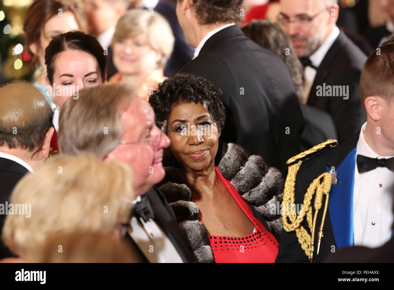 Washington, District of Columbia, USA. 4th Dec, 2016. Singer Aretha Franklin leaves the East Room after attending an event for the 2016 Kennedy Center Honorees, in the East Room of the White House, December 4, 2016. The 2016 honorees are: Argentine pianist Martha Argerich; rock band the Eagles; screen and stage actor Al Pacino; gospel and blues singer Mavis Staples; and musician James Taylor.Credit: Aude Guerrucci/Pool via CNP Credit: Aude Guerrucci/CNP/ZUMA Wire/Alamy Live News Stock Photo