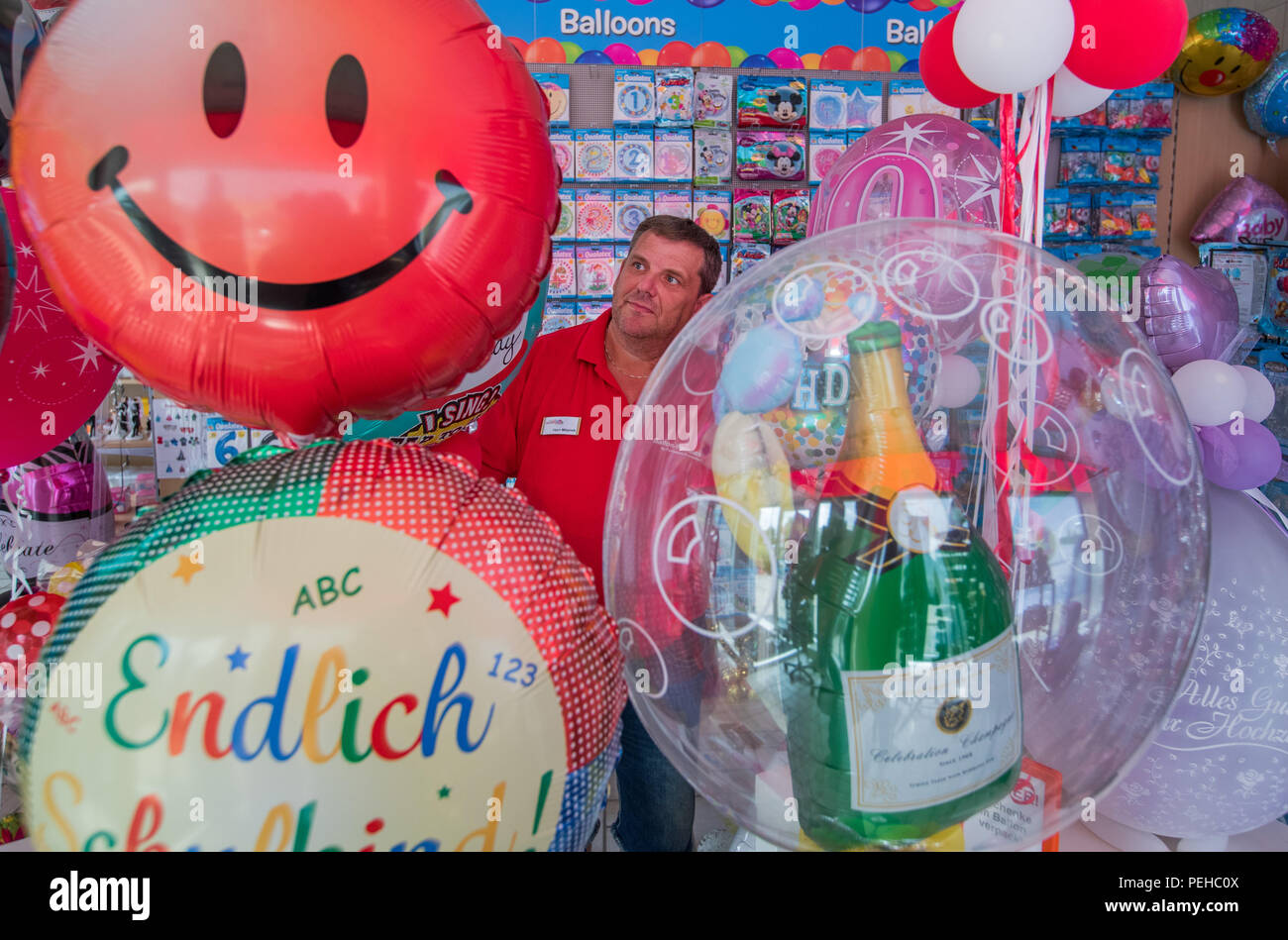 Zeulenroda, Germany. 14th Aug, 2018. Owner Sven Mlejnek sorts various  balloons in his specialty shop "Ballon-Paradies". In this unique shop in  Thuringia you can choose from more than 2,000 different balloons. On