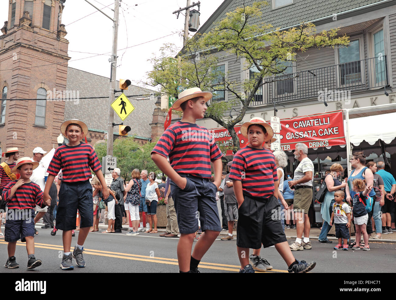 Cleveland, USA. 15th Aug, 2018.  Participants in the 120th Annual Feast of the Assumption opening street procession in Cleveland's Little Italy neighborhood make their way past Presti's Bakery on Mayfield Road.  This annual celebration is muti-faceted and is a display of the Italian heritage in Cleveland, Ohio. Credit: Mark Kanning/Alamy Live News. Stock Photo