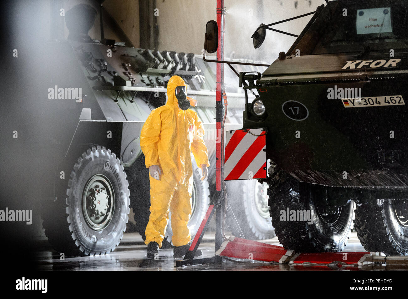 Prizren, Kosovo. 18th July, 2018. A transport tank of the type 'Fuchs'  drives through a kind of car wash in a warehouse and is sprayed with formic  acid. This is intended to