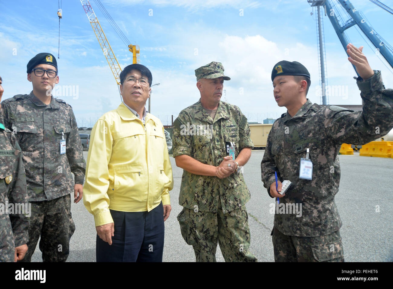 BUSAN, Republic of Korea - Ye-Jong Woo (second from left), chief executive  officer of the Busan Port Authority, receives a tour of USNS Red Cloud  (T-AKR 313) Aug. 19. MSC operates approximately