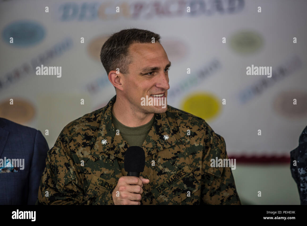 U.S. Marine Corps Lt. Col. John Lehman, a civil affairs officer assigned to 4th Civil Affairs Group, addresses the public at a community relations event in Santo Domingo, Dominican Republic during Operation Continuing Promise, Aug. 18, 2015. Operation Continuing Promise is a mission to countries in Central and South America and the Caribbean, where the U.S. Military and its partnering nations work with host nations and a variety of governmental and non-governmental agencies in civil-military operations. (U.S. Marine Corps photo by Sgt. James R. Skelton/Released) Stock Photo