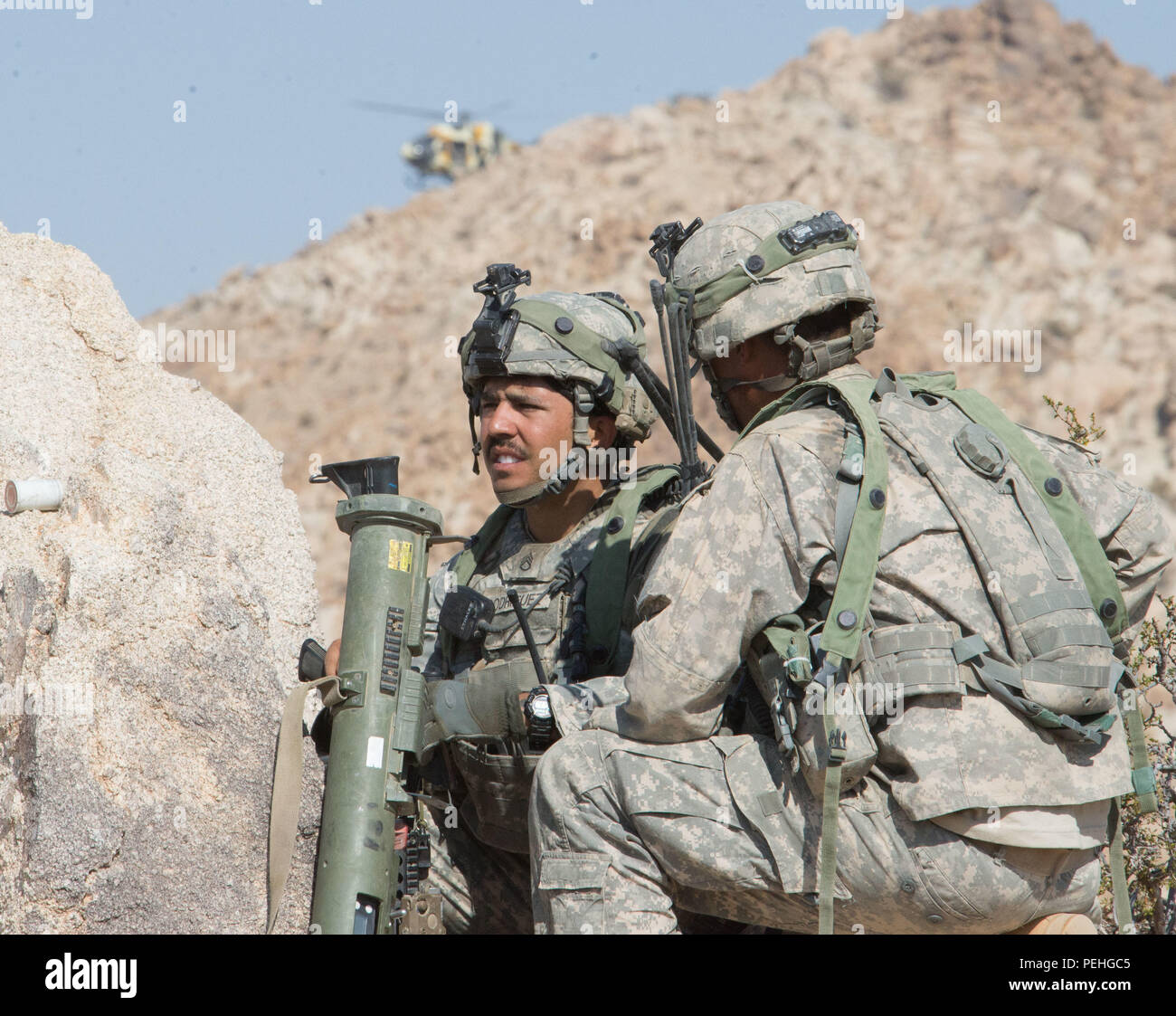 Staff Sgt. Rodriguez, 3rd Platoon, A Company, 3rd Battalion, 116th Cavalry Brigade Combat Team, receives a situation report prior to an enemy helicopter attack during a battle simulation exercise at the National Training Center (NTC), Fort Irwin, Calif., Aug. 22. The 116th CBCT is participating in battle simulation scenarios with more than 5,000 Soldiers with National Guard units from 10 states, the U.S. Army Reserve and active duty U.S. Army Soldiers as part of their annual training. (Photo by Maj. W. Chris Clyne, 115th Mobile Public Affairs Detachment) Stock Photo