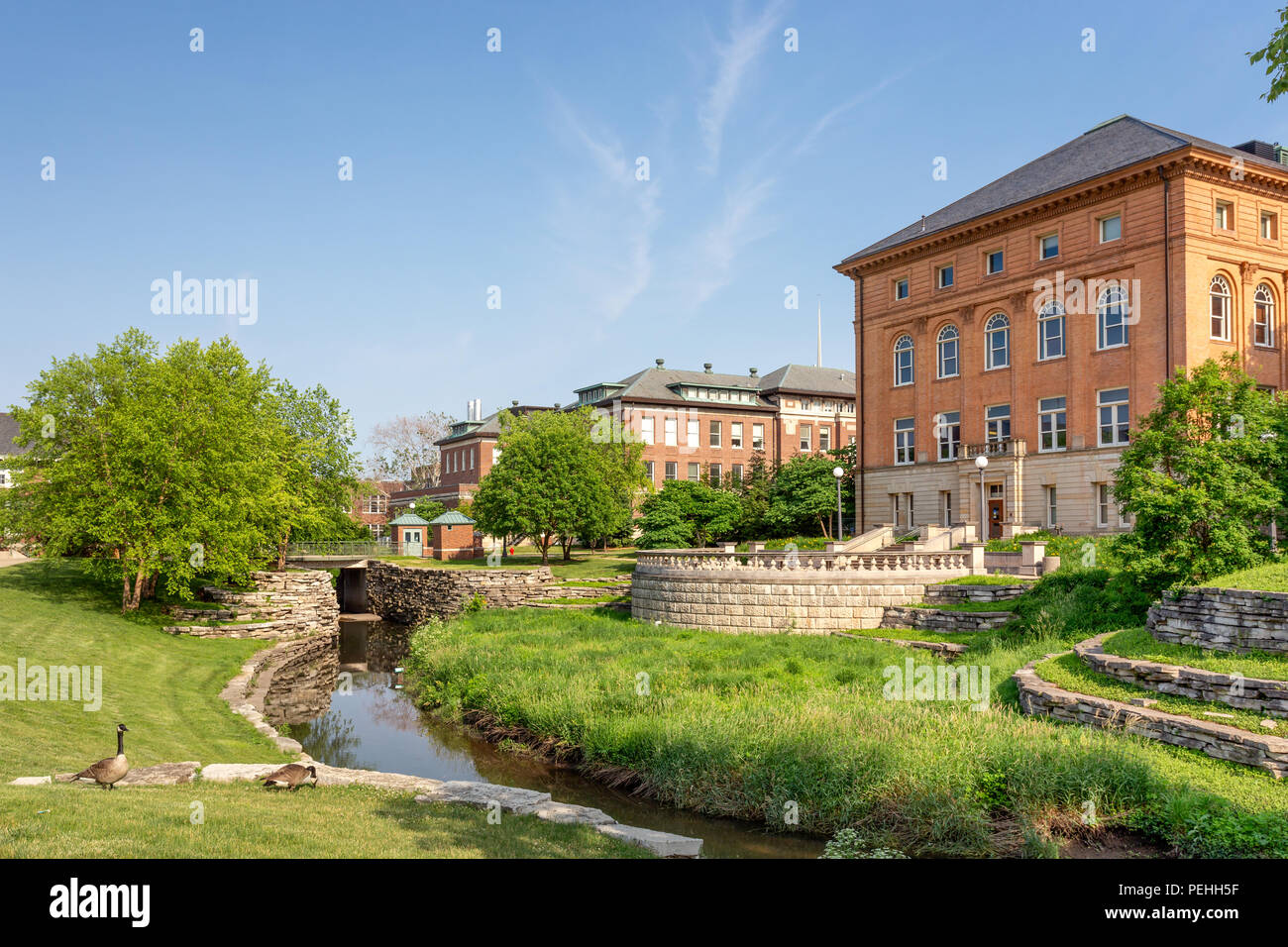 URBANA, IL/USA - JUNE 2, 2018: Boneyard Creek and campus buildings on the campus of the University of Illinois at Urbana–Champaign. Stock Photo