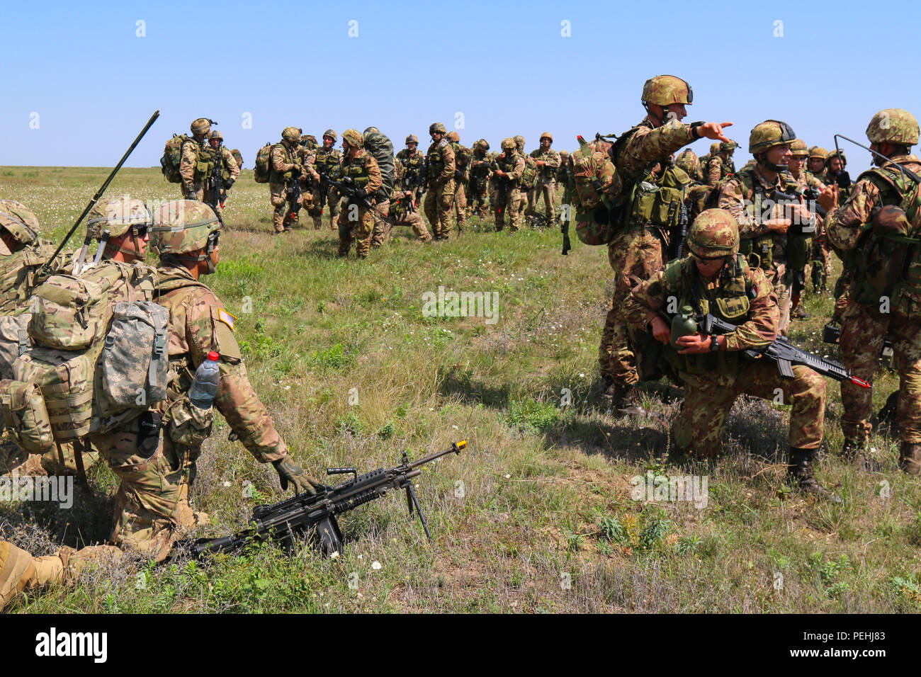 Paratroopers From The U S Army And Italian Army Take A Knee And Coordinate Movement On Balchik Air Base Bulgaria During Swift Response 15 Aug 25 15 Swift Response 15 Is A Large Scale