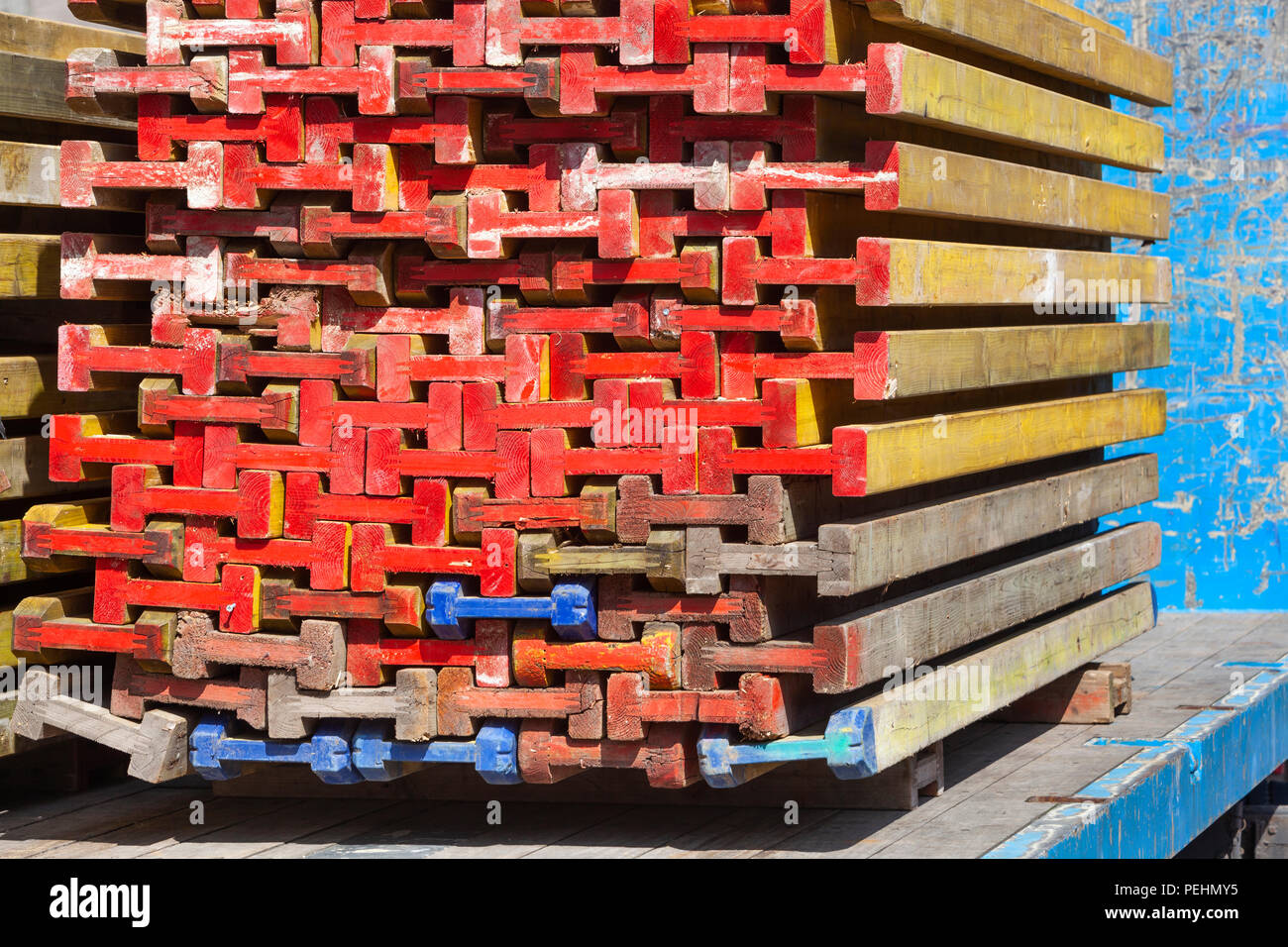 Colorful wooden beams for building market stalls stacked on a truck in the Netherlands Stock Photo