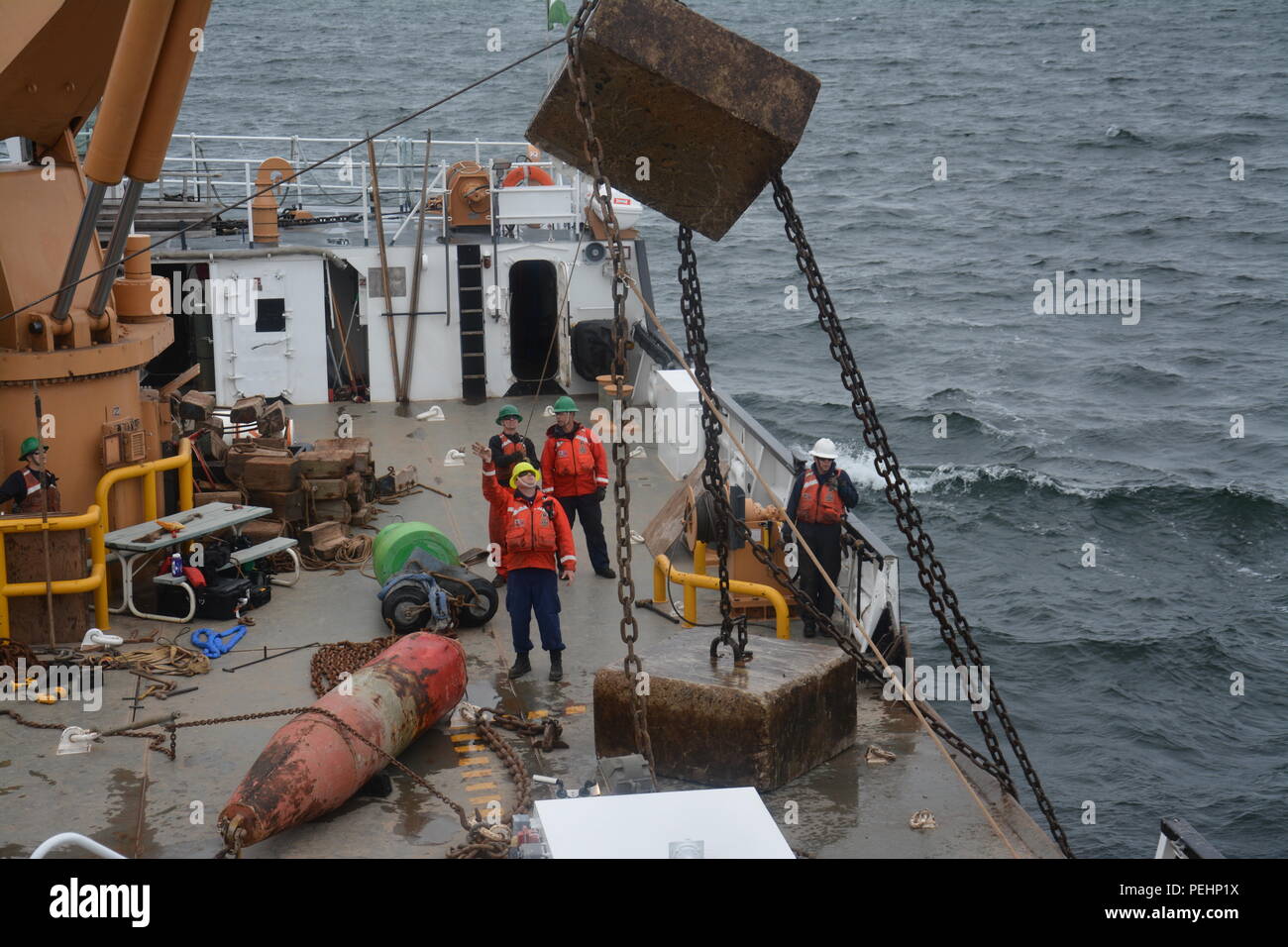 Crew Aboard The Coast Guard Cutter Mobile Bay, A 140-foot Icebreaking 