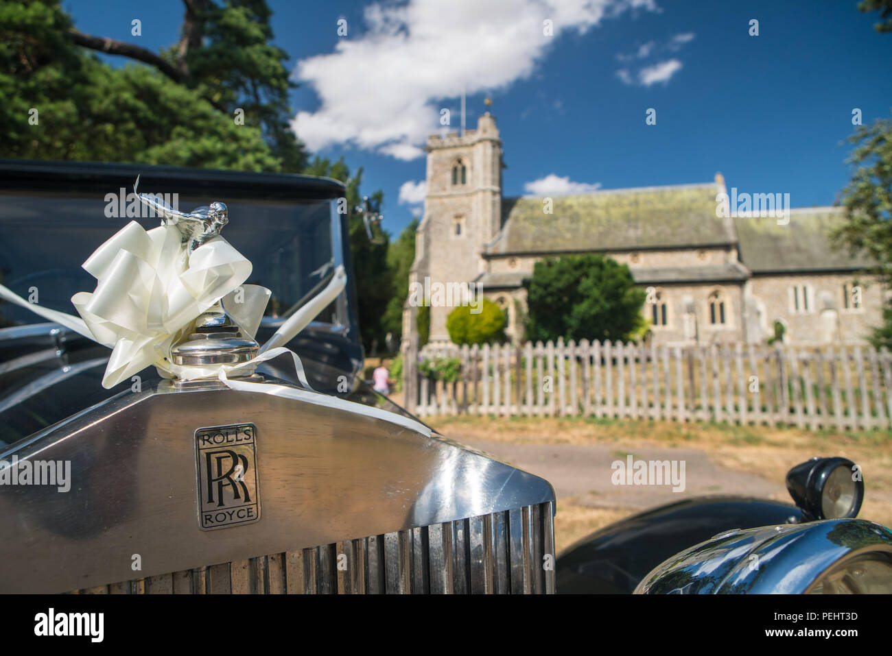 Vintage Rolls Royce wedding car outside an English church Stock Photo