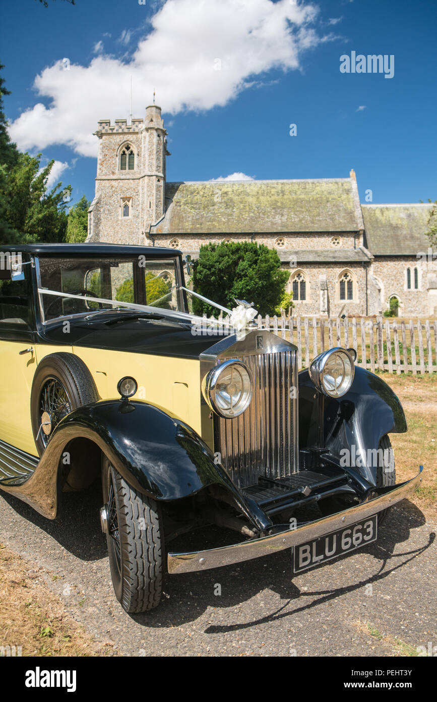 Vintage Rolls Royce wedding car outside an English church Stock Photo