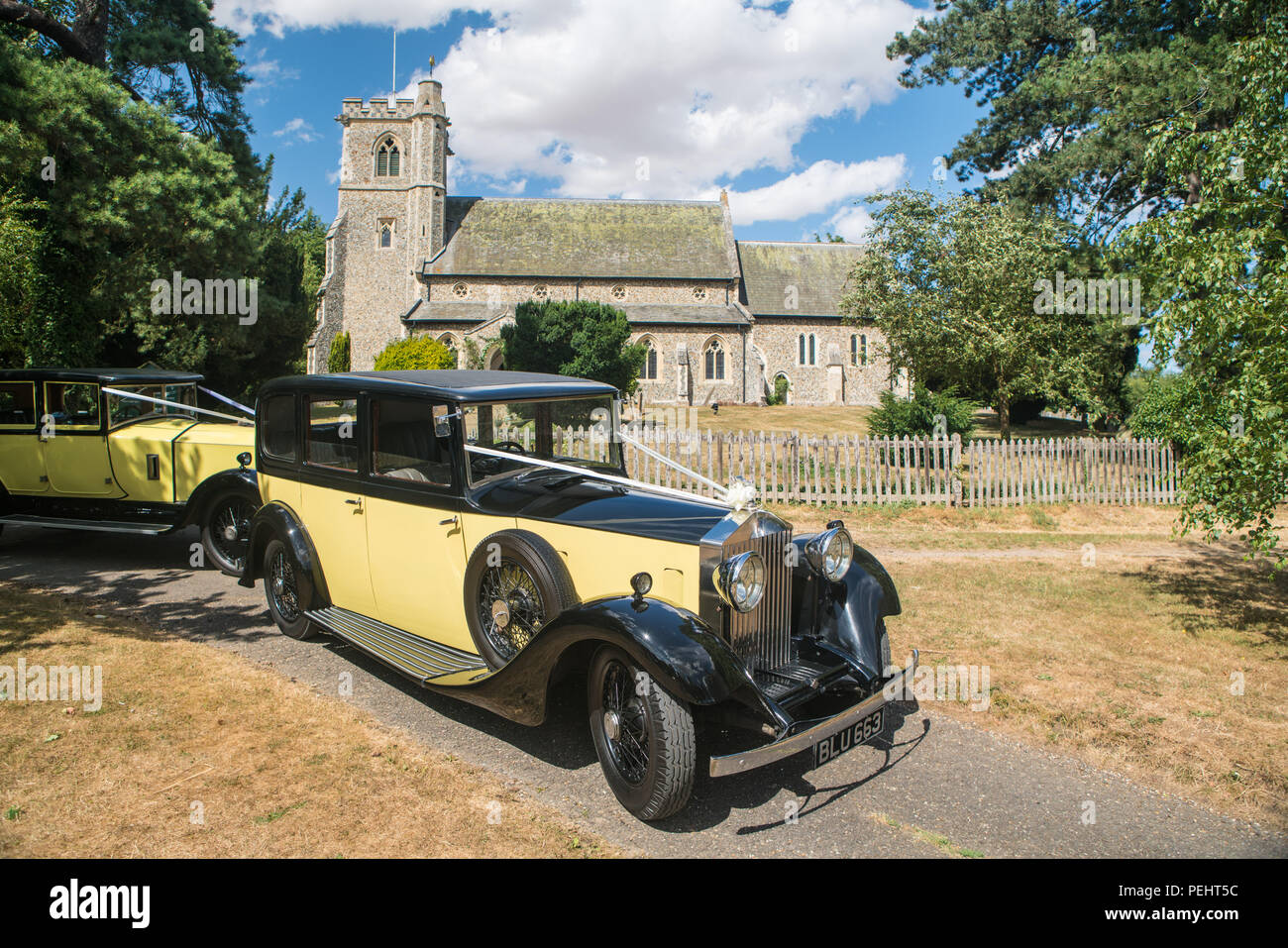 Vintage Rolls Royce wedding car outside an English church Stock Photo