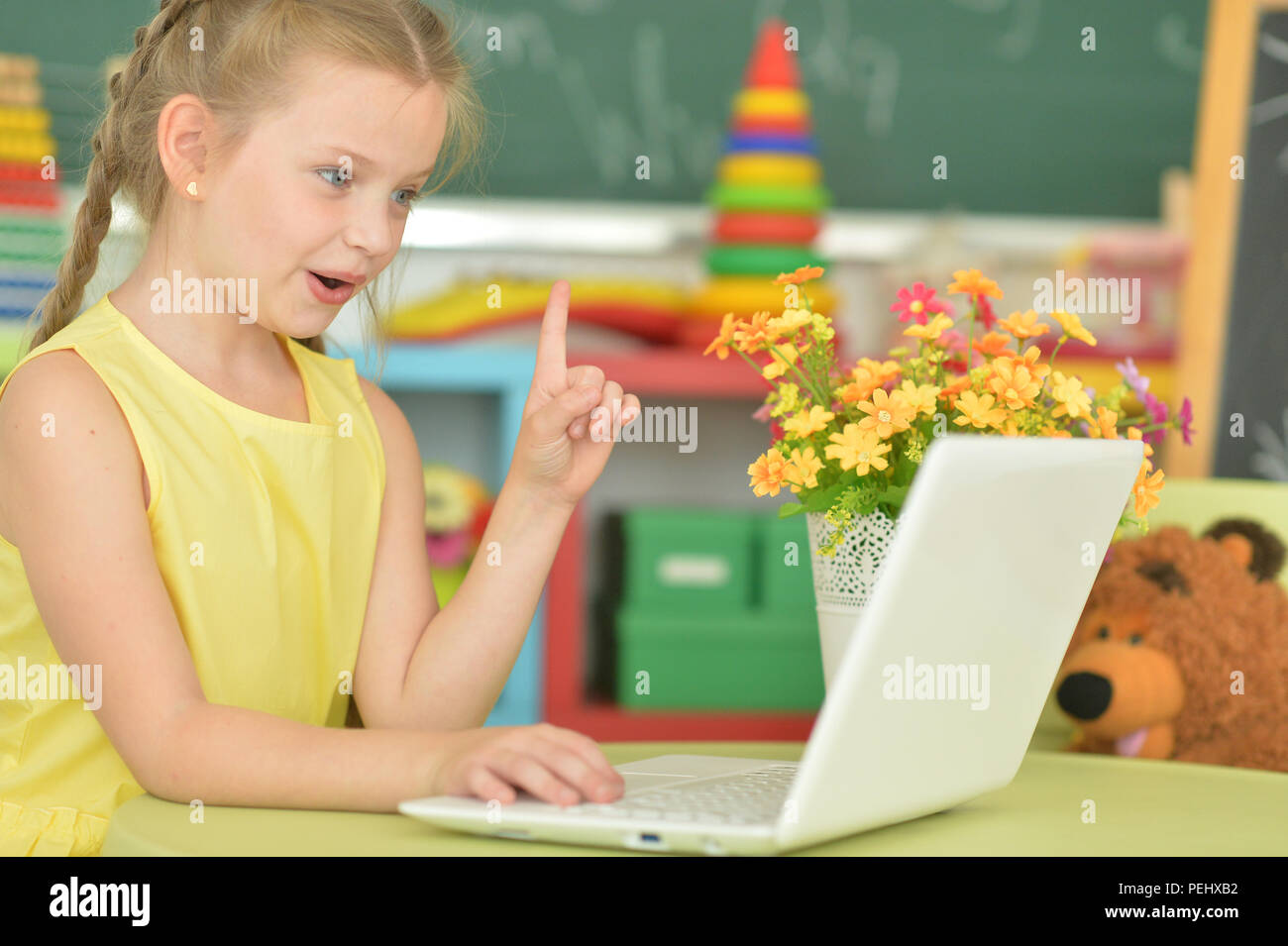 Portrait of an emotional girl using laptop Stock Photo