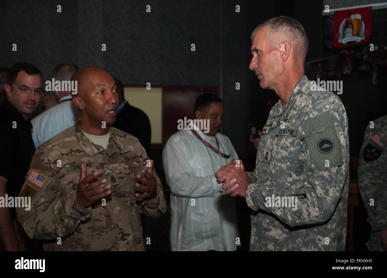 Army Command Sgt. Maj. Luther Thomas Jr. (left), command sergeant major, U.S. Army Reserve, and Army Maj. Gen. James F. Pasquarette, commanding general, U.S. Army Japan & I Corps (Forward) (right), discuss the challenges and opportunities facing their respective commands Aug. 18, 2015, at Camp Zama, Japan. Earlier that morning, Thomas and dozens of Soldiers, family members and Department of Defense civilians gathered at the Camp Zama Community Club to watch Pasquarette pin the rank of colonel onto newly promoted Army Col. Timothy M. Snyder (right), director, Army Reserve Engagement Team-Japan  Stock Photo