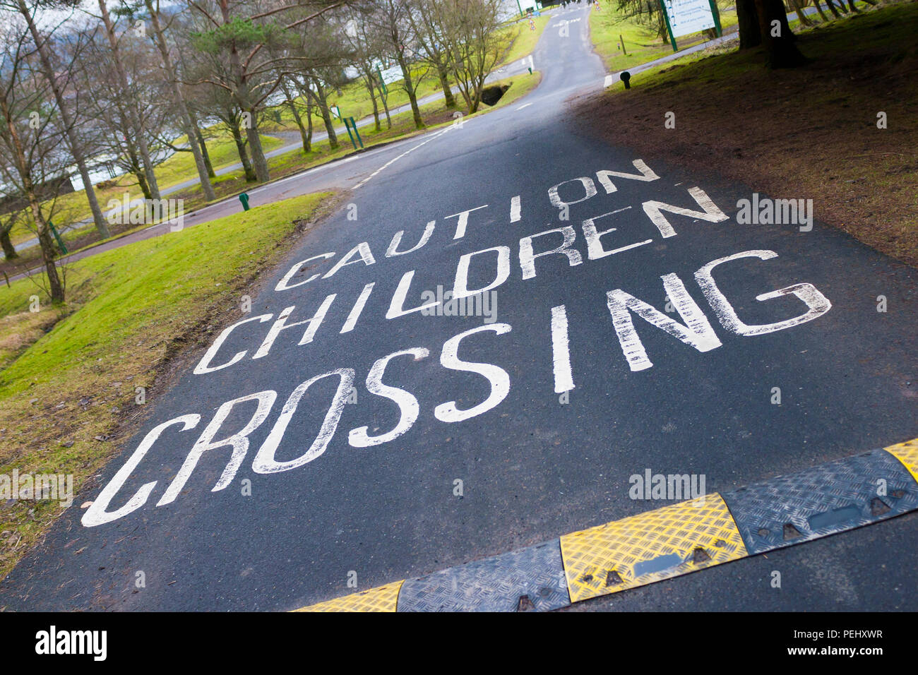 Painted Road Markings Warning of Children Stock Photo