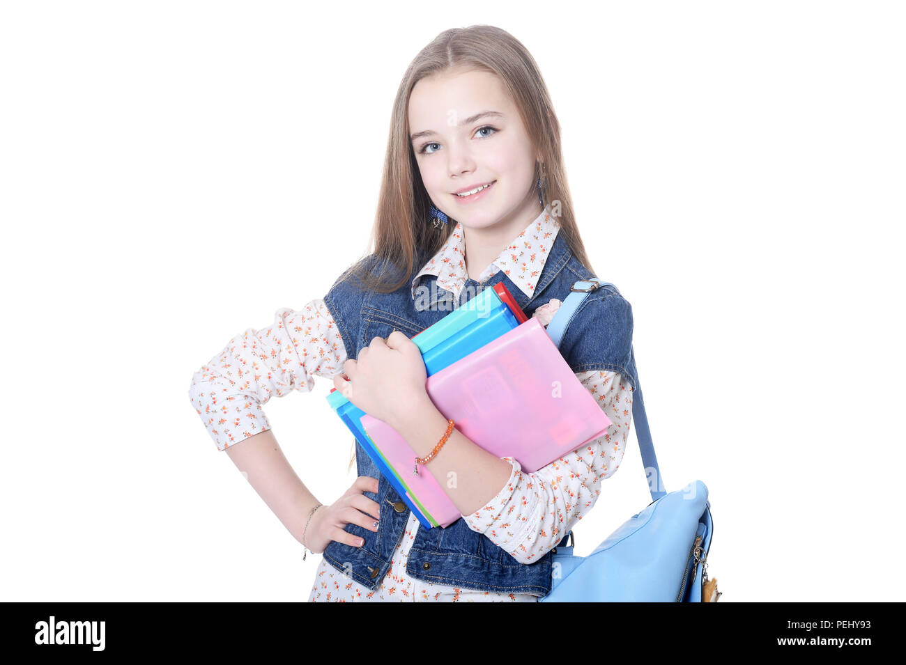 Schoolgirl posing with books isolated on white background Stock Photo ...