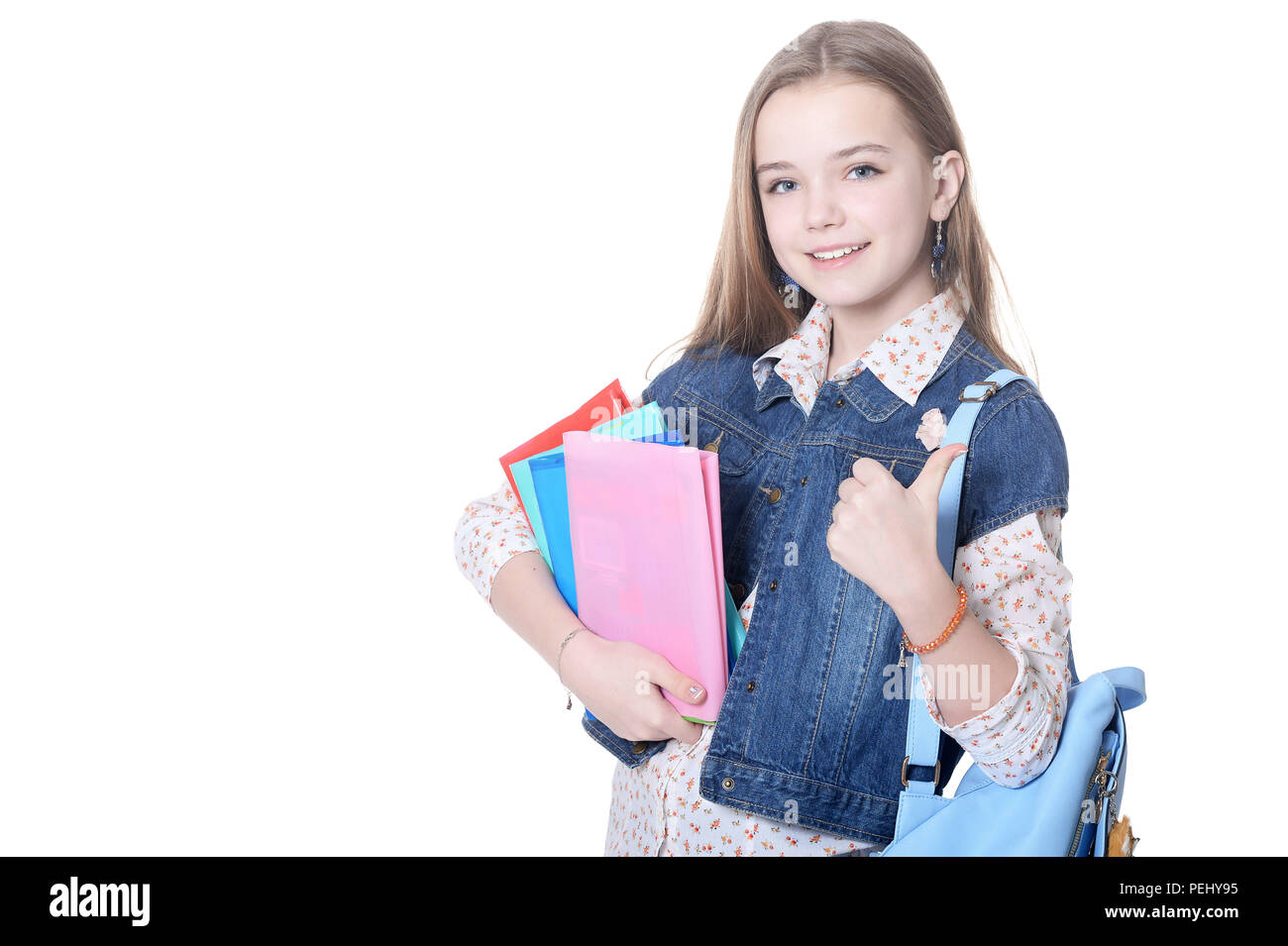 Schoolgirl posing with books isolated on white background Stock Photo ...