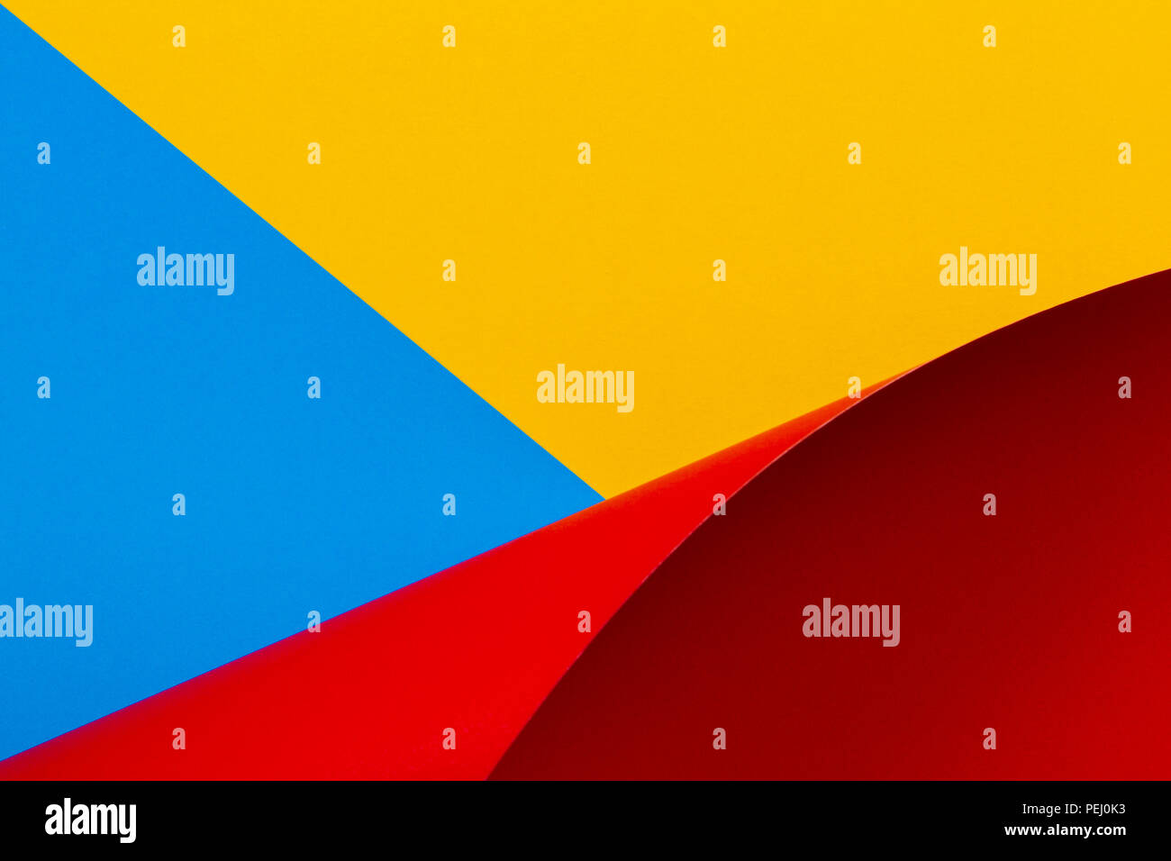 Abstract colorful background. Yellow blue red paper in geometric shapes Stock Photo