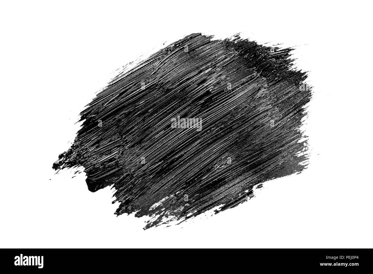 Abstract grunge brush stroke made with slack acrylic paint, isolated on white. Perfect for your design. Stock Photo