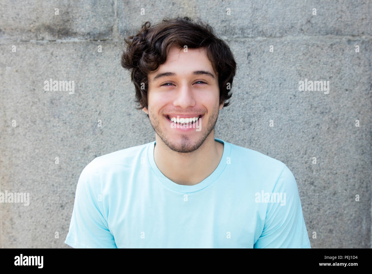 Portrait Of A Handsome Caucasian Young Adult Man With Blue Eyes
