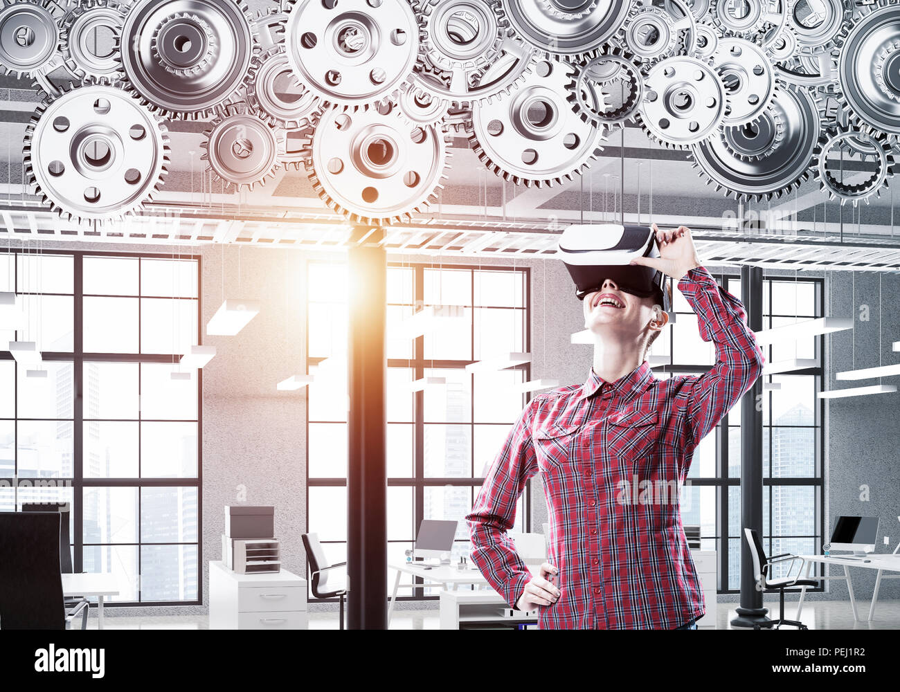 Girl in casual wearing VR glasses and experiencing virtual reali Stock Photo