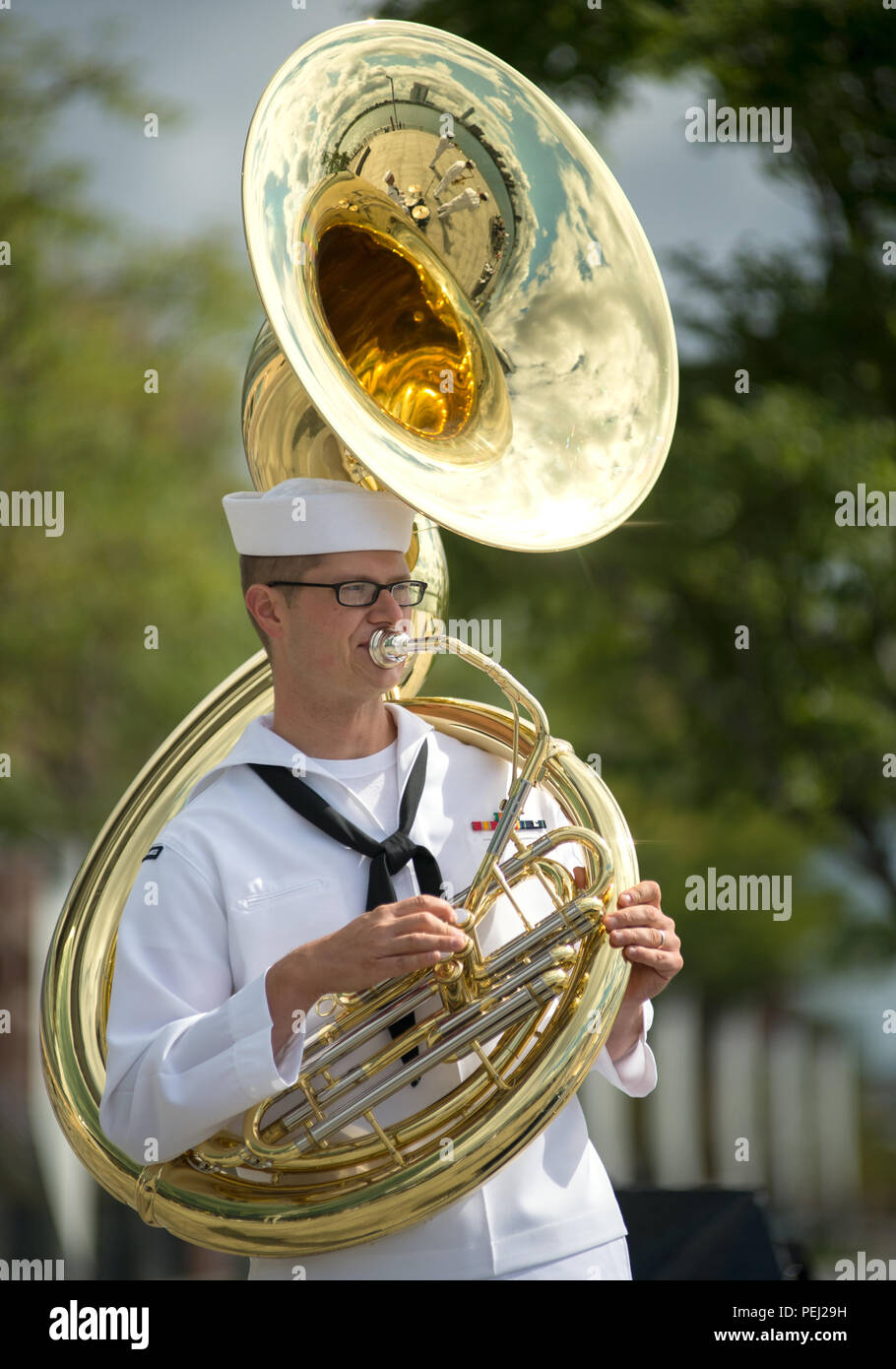 150826-N-CI175-054 DETROIT, Mich. (Aug. 26, 2015) Musician 3rd Class Collin Moos, assigned to the Navy Band Great Lakes Brass Band, plays in a concert along Detroit’s downtown RiverWalk as part of Detroit Navy Week. Navy Weeks focus a variety of assets, equipment and personnel on a single city for a week-long series of engagements designed to bring America's Navy closer to the people it protects, in cities that don't have a large naval presence. (U.S. Navy photo by Mass Communication Specialist 1st Class Jon Rasmussen/Released) Stock Photo