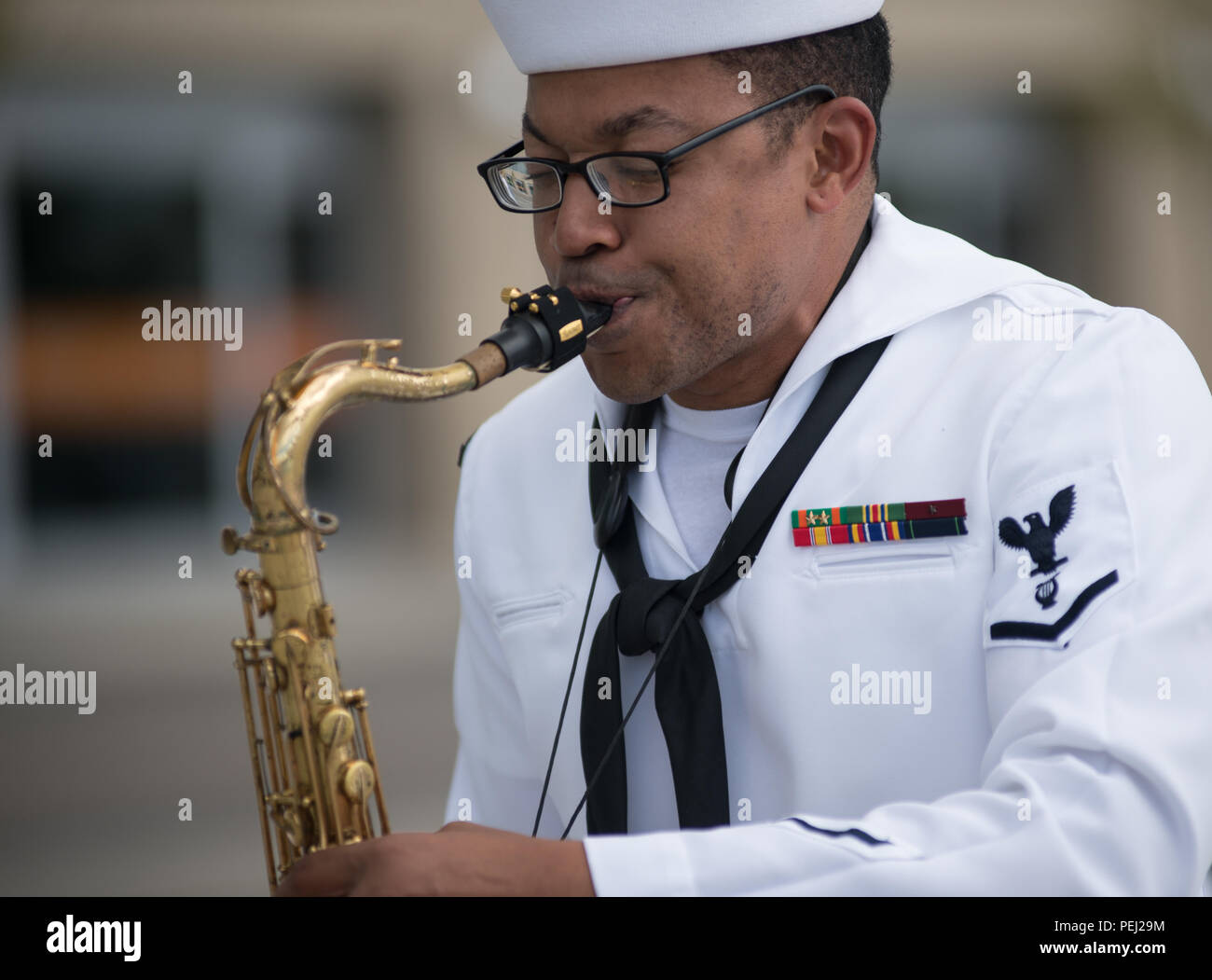 150826-N-CI175-085 DETROIT, Mich. (Aug. 26, 2015) Musician 3rd Class Jason Gay, assigned to the Navy Band Great Lakes Brass Band, plays in a concert along Detroit’s downtown RiverWalk as part of Detroit Navy Week. Navy Weeks focus a variety of assets, equipment and personnel on a single city for a week-long series of engagements designed to bring America's Navy closer to the people it protects, in cities that don't have a large naval presence. (U.S. Navy photo by Mass Communication Specialist 1st Class Jon Rasmussen/Released) Stock Photo