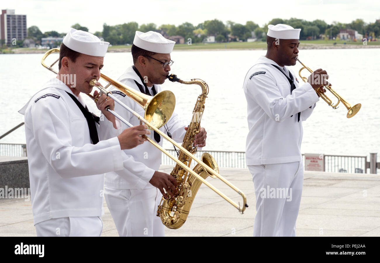 150826-N-CI175-124 DETROIT, Mich. (Aug. 26, 2015) Musicians assigned to the Navy Band Great Lakes Brass Band perform along Detroit’s downtown RiverWalk as part of Detroit Navy Week. Navy Weeks focus a variety of assets, equipment and personnel on a single city for a week-long series of engagements designed to bring America's Navy closer to the people it protects, in cities that don't have a large naval presence. (U.S. Navy photo by Mass Communication Specialist 1st Class Jon Rasmussen/Released) Stock Photo