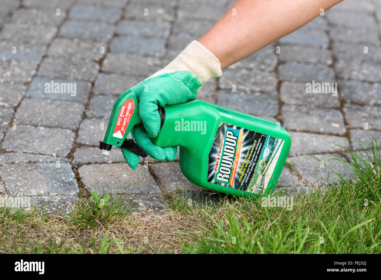 Paris France August 15 2018 Gardener Using Roundup Herbicide In A Paris france august 15 2018 gardener using roundup herbicide in a