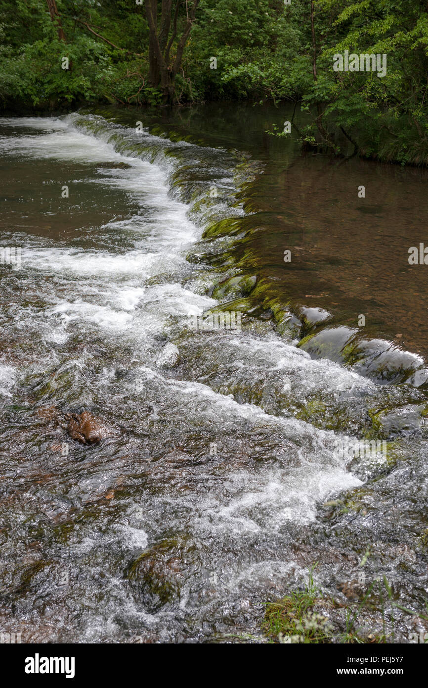 Shallow weir on the River Dove, Dovedale, Derbyshire Stock Photo