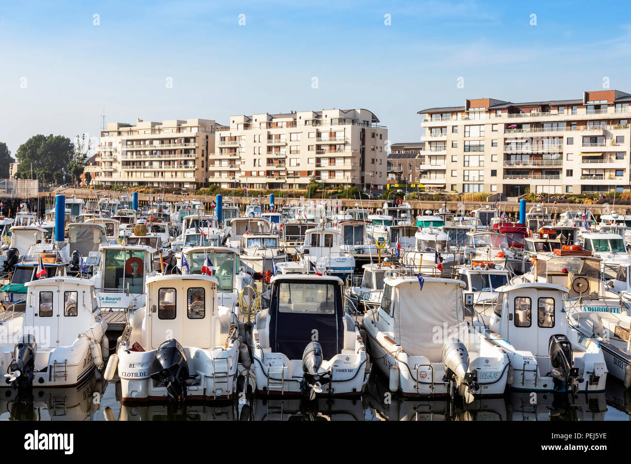 Local fleet of small boats in Dunkirk harbour, Dunkirk, France Stock Photo