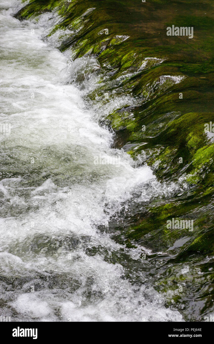 Close-up of a shallow weir on the River Dove, Dovedale, Derbyshire Stock Photo