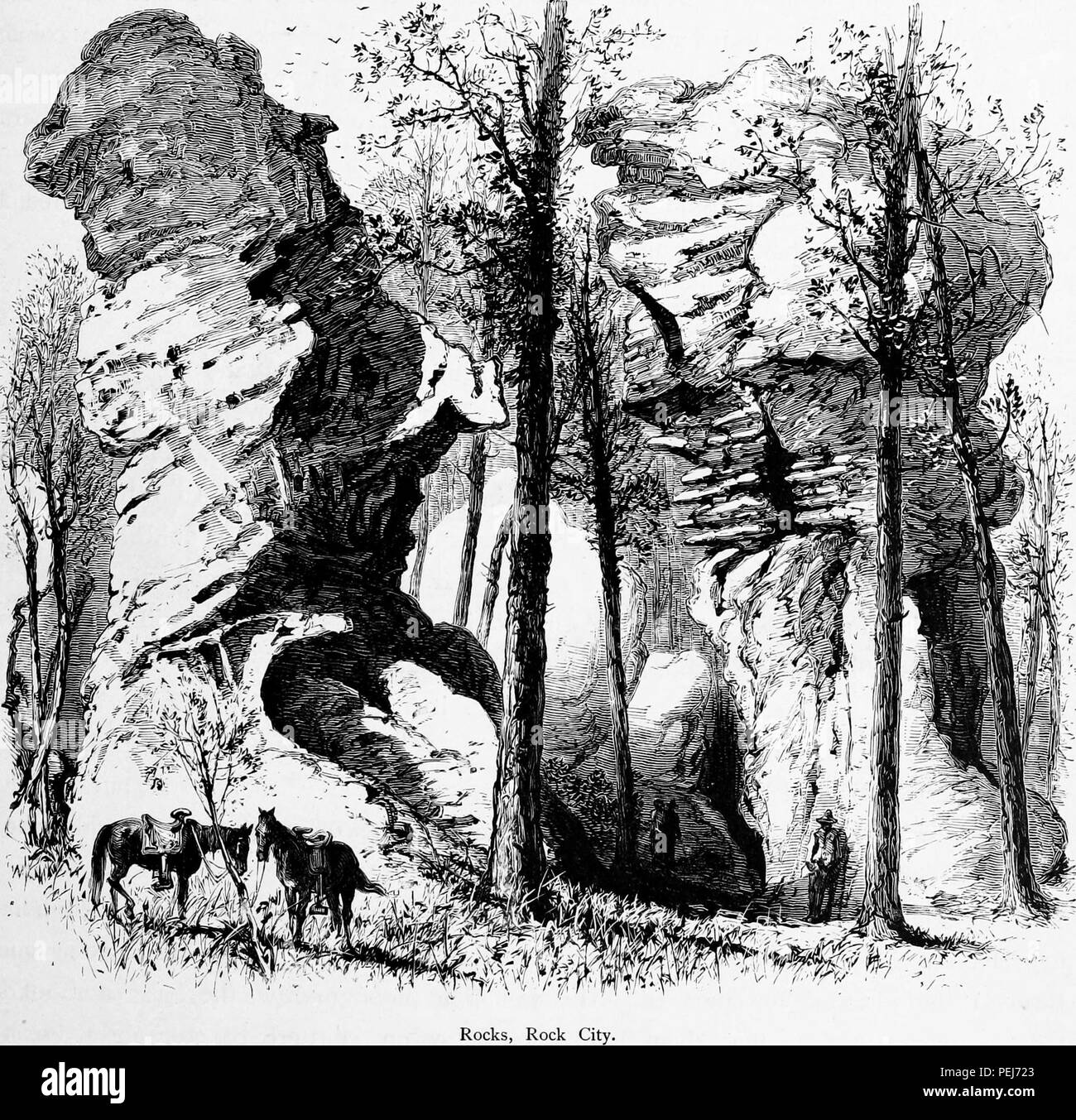 Black and white vintage print depicting horses and people near a stand of rocks at Rock City, a naturally occurring geological formation located on Lookout Mountain in Georgia, USA, published in William Cullen Bryant's edited volume 'Picturesque America; or, The Land We Live In', 1872. Courtesy Internet Archive. () Stock Photo